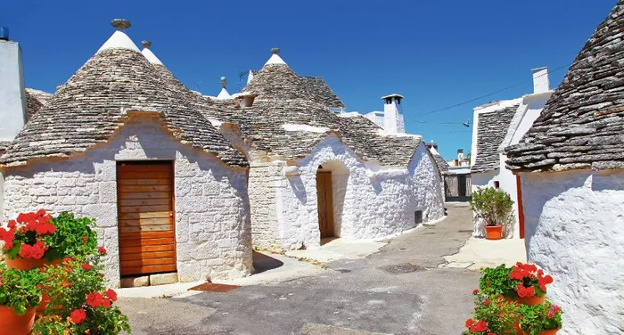 Unique Trulli houses with conical roofs in Alberobello, Italy, P